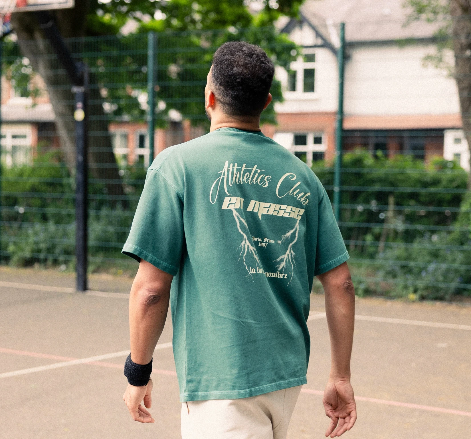 En Masse Athletics Club tee back graphic on court