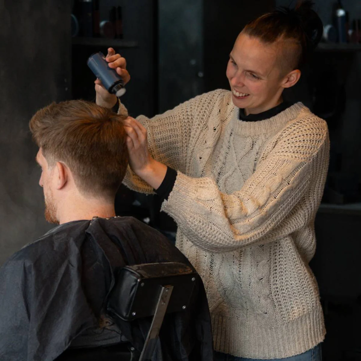 Rhiannah barbering a client