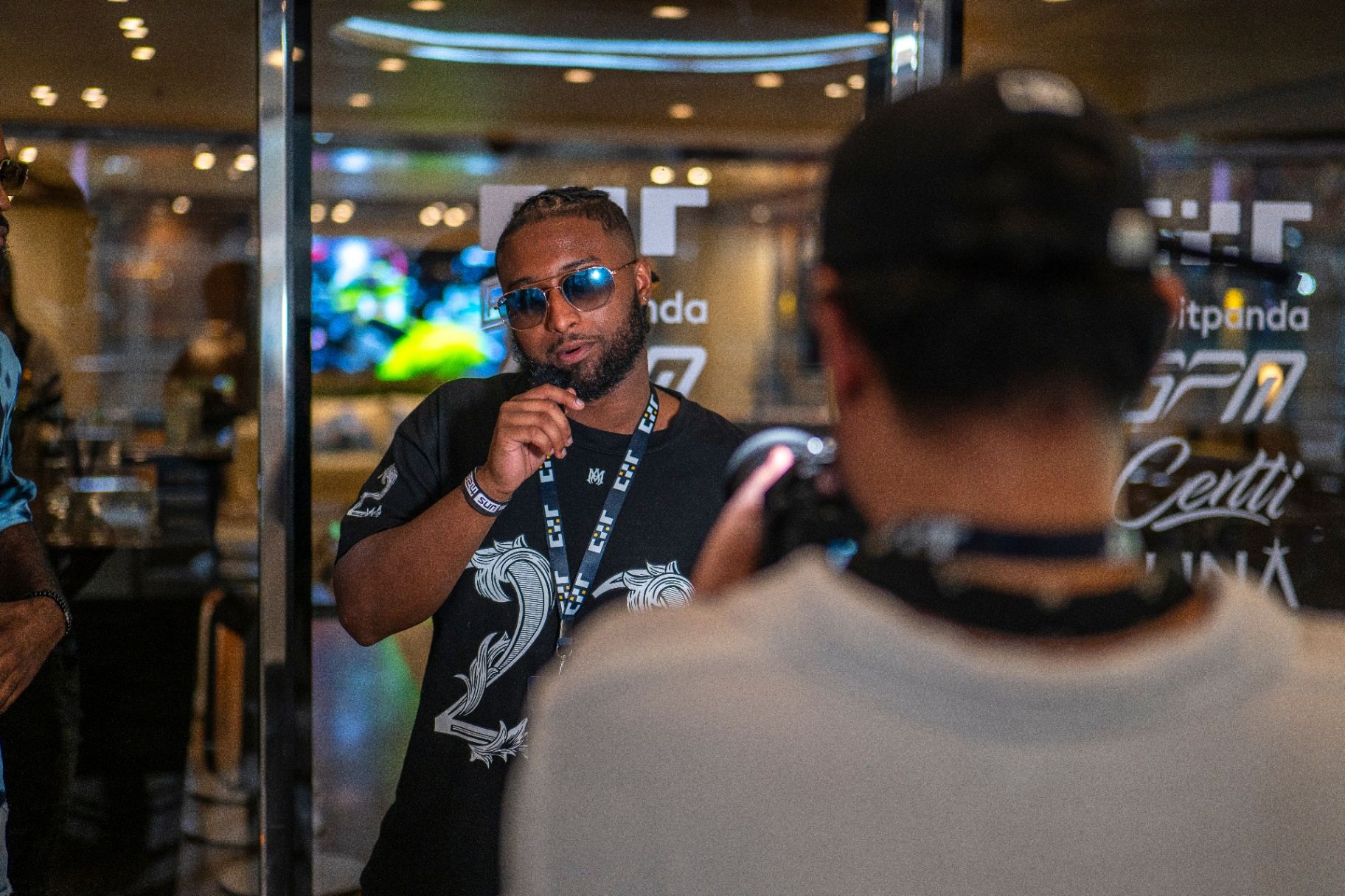 Guest being photographed during a portrait session in the hospitality suite