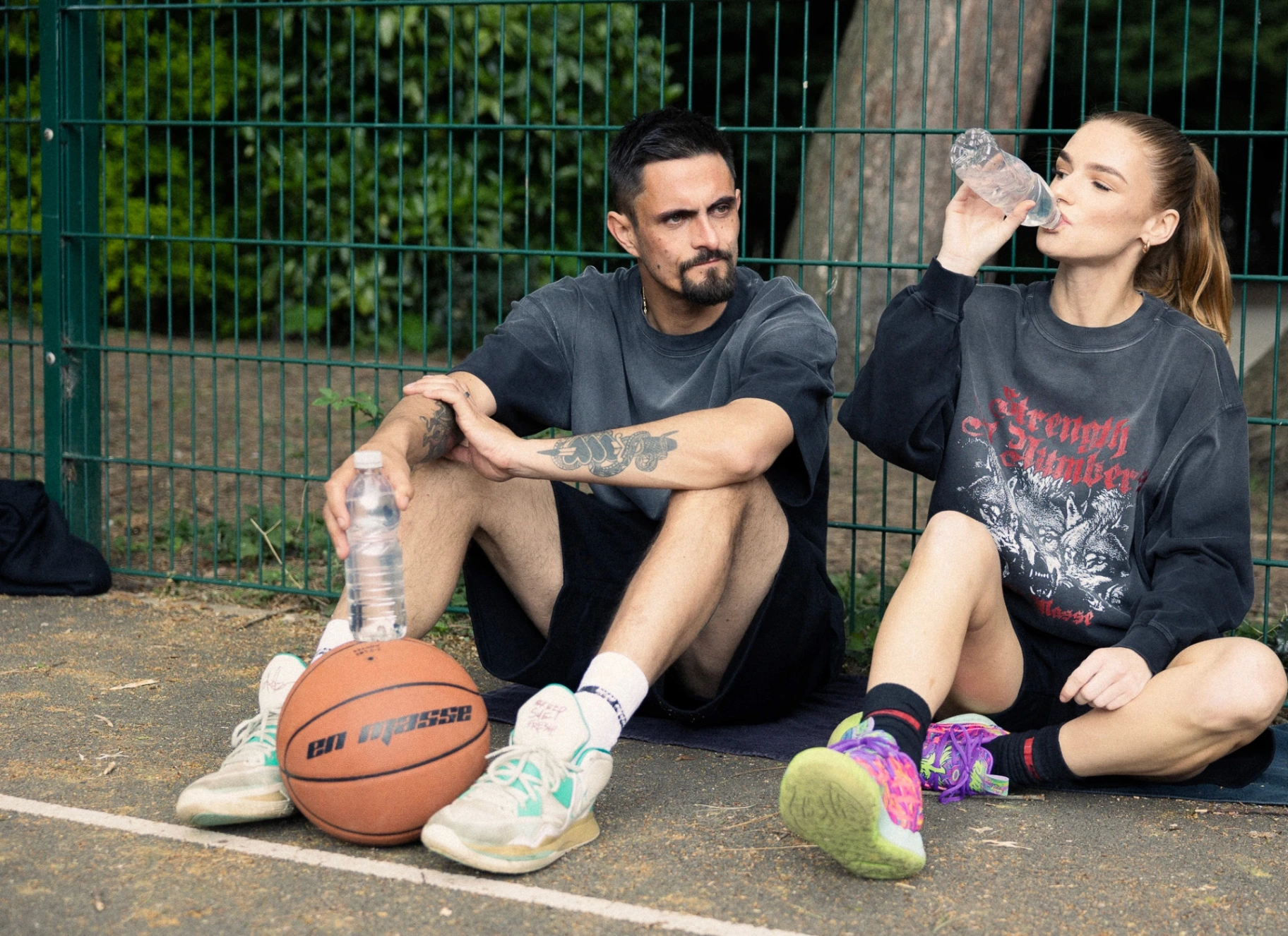 Courtside portrait of two En Masse wearers