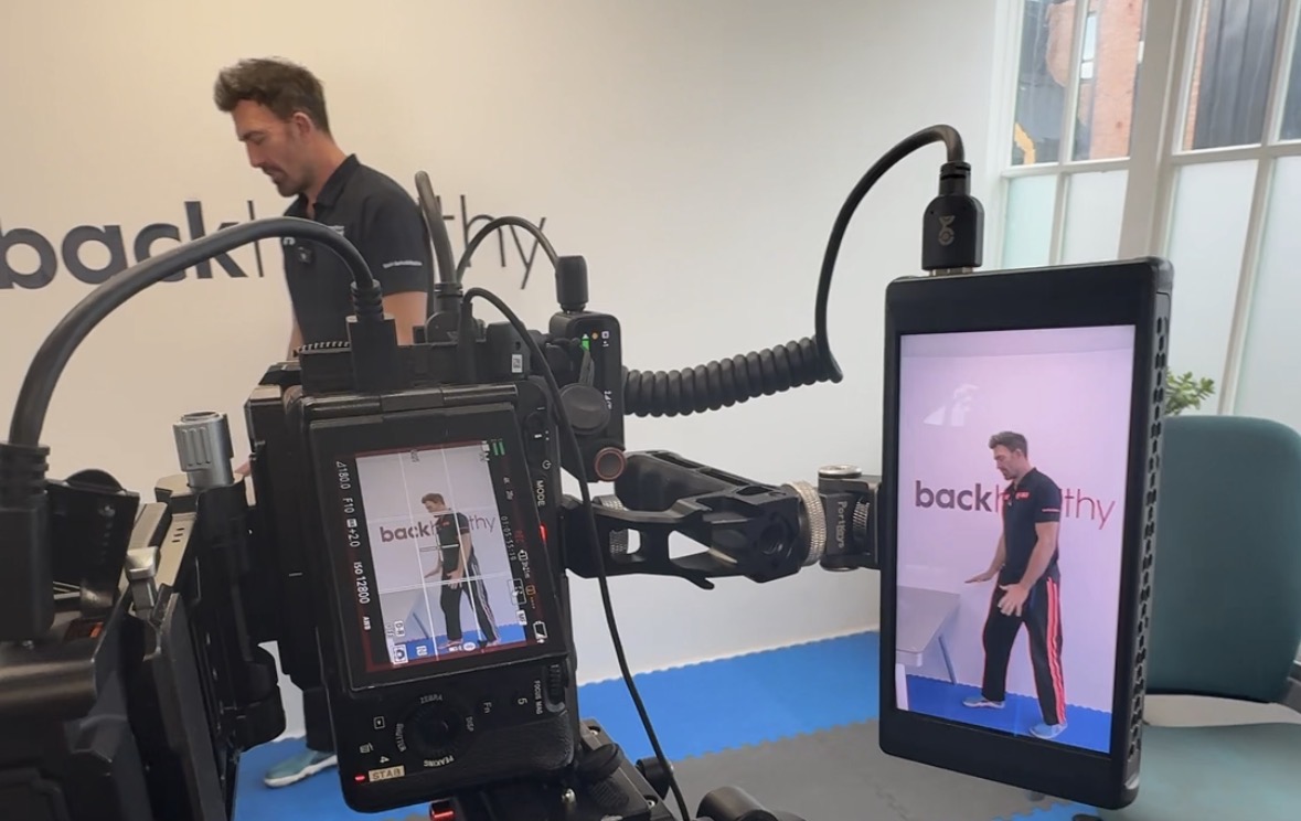 On-set monitor and camera capturing a vertical brand film for backhealthy